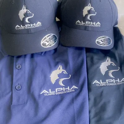custom-embroidered-uniforms-alpha-claims-miami-epic-tees Custom embroidered navy hats and polos with Alpha Claims Consultants logo by Miami Epic Tees