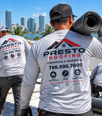 Roofing contractors wearing custom printed long sleeve work shirts on a commercial rooftop in Miami.